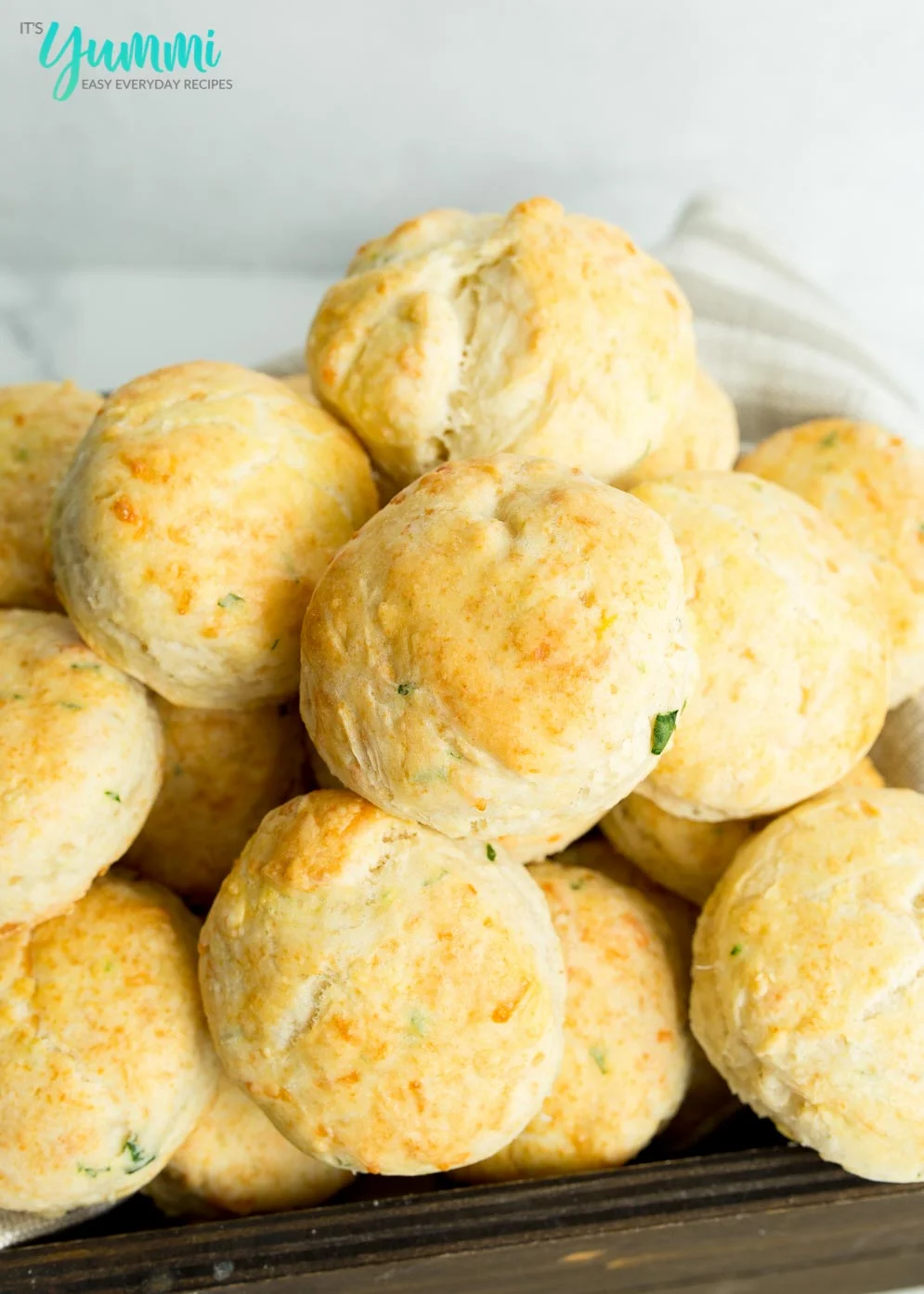Close-up of Baked Cheddar Bay Biscuits in wooden basket