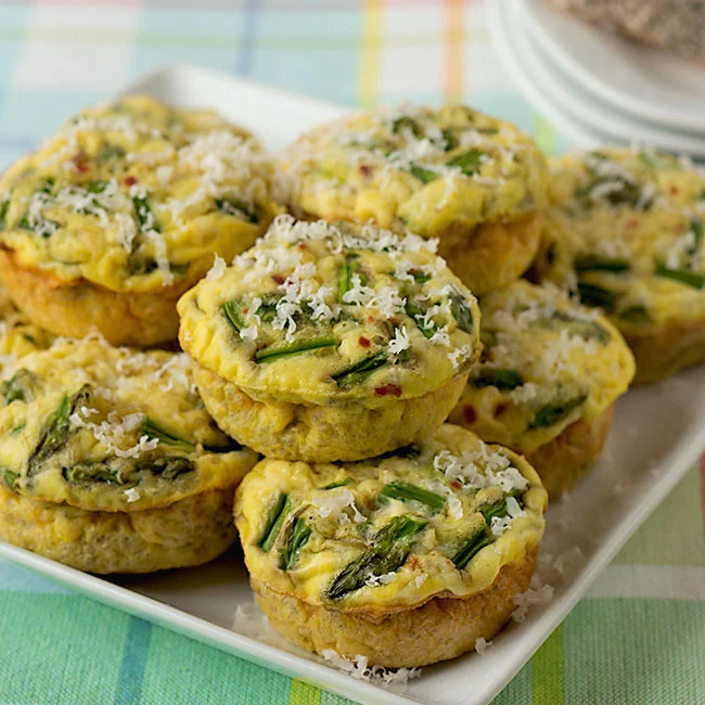 plate of gluten free muffins with eggs, quinoa, asparagus and Parmesan cheese